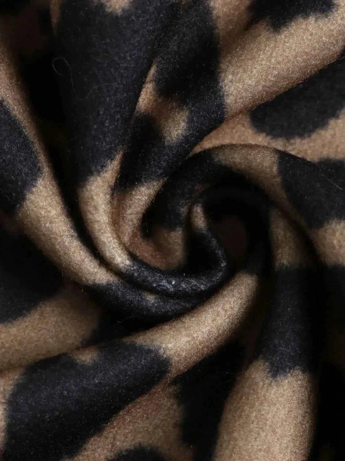 Close-up of leopard print polyester fabric for casual button-up jacket